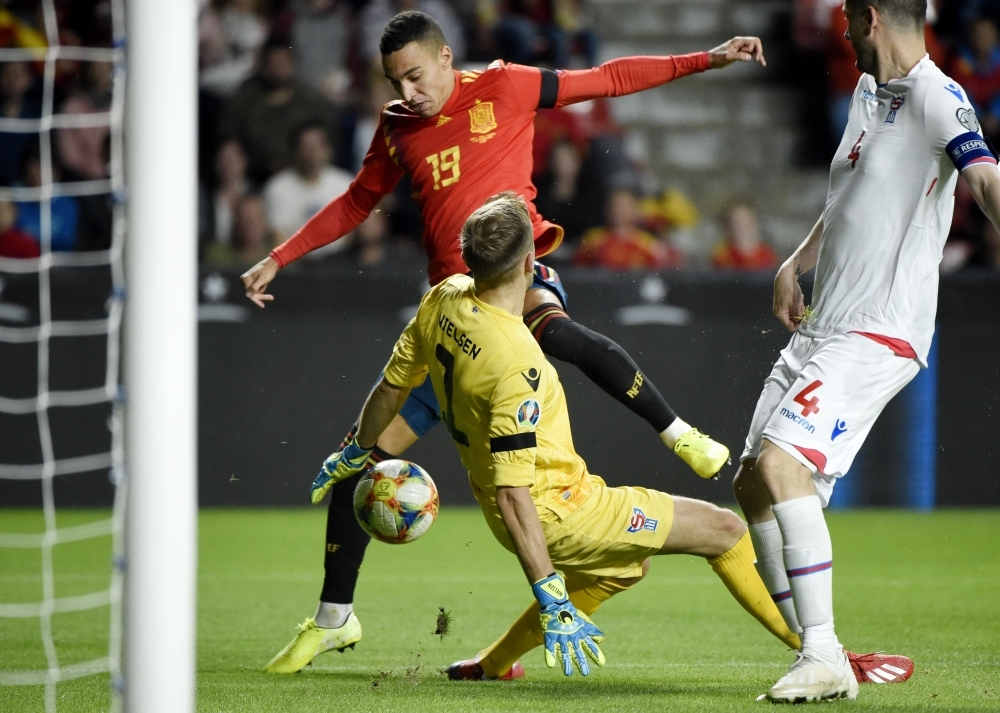 Spain's forward Rodrigo (TOP) scores his second goal during the UEFA Euro 2020 qualifier group F football match between Spain and Faroe Islands at El Molinon stadium in Gijon, on Sunday. — AFP