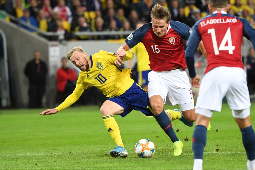 Sweden's Emil Forsberg fights for the ball with Norway's Sander Berge during Euro 2020 men's qualifiers Group F game at Tampere, Sweden, on Sunday. — Reuters