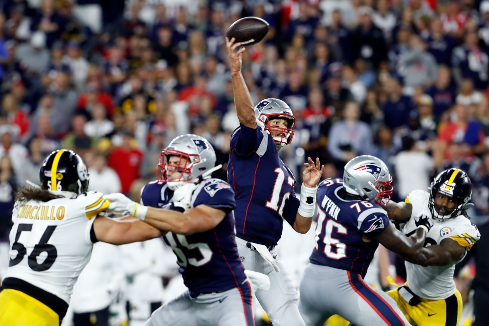 New England Patriots quarterback Tom Brady (12) passes the ball against the Pittsburgh Steelers during the first half at Gillette Stadium. — Reuters