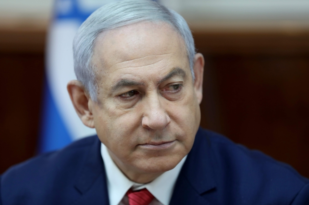 Israeli Prime Minister Benjamin Netanyahu attends the weekly Cabinet meeting at his office in Jerusalem on Sunday. — AFP