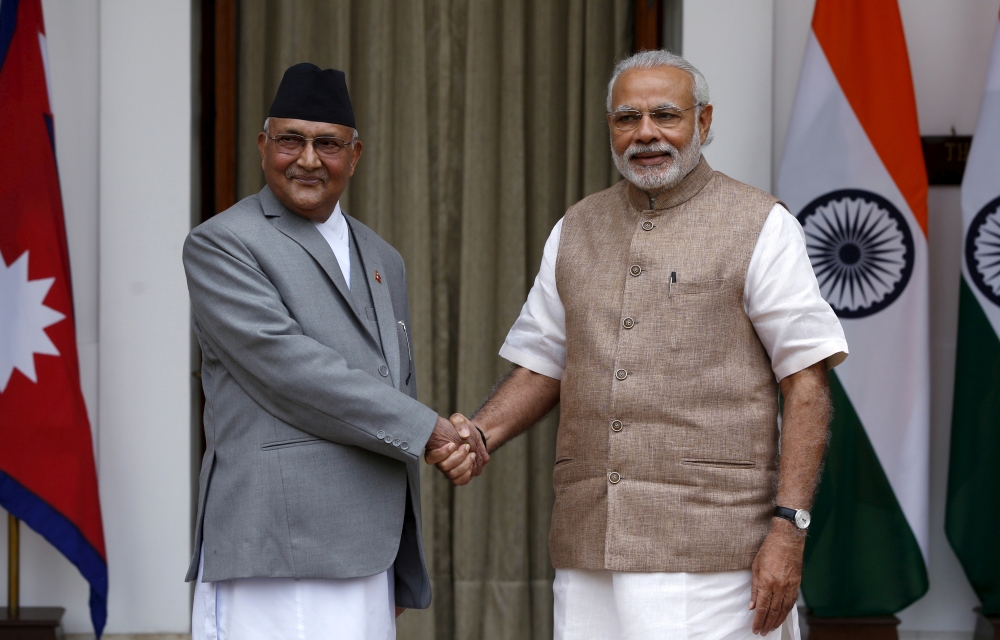 Nepal's Prime Minister Khadga Prasad Sharma Oli, left, shakes hands with his Indian counterpart Narendra Modi during a photo opportunity ahead of their meeting at Hyderabad House in New Delhi, India, in this Feb. 20, 2016 file photo. — Reuters