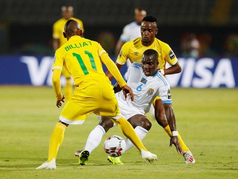 DR Congo's Chadrac Akolo in action with Zimbabwe's Khama Billiat. — Reuters