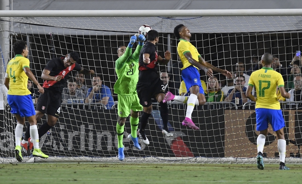 Goalkeeper Ederson of Brazil is unable to stop a header by Luis Abram of Peru for a goal in the 2019 International Champions Cup in Los Angeles, California, on Tuesday. — AFP