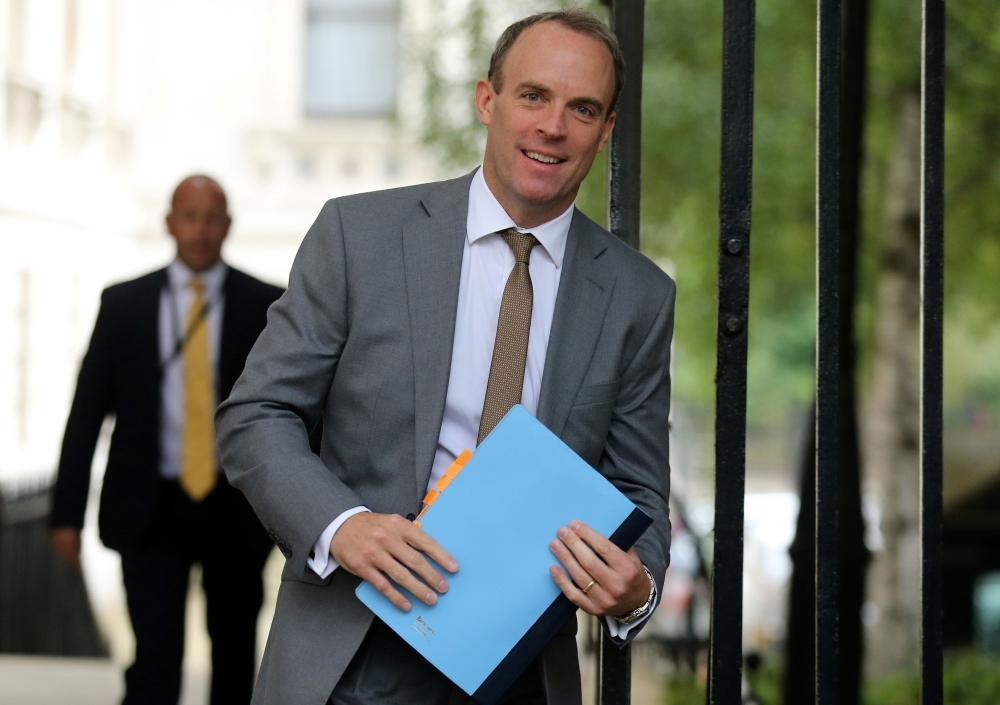 Britain's Foreign Secretary and First Secretary of State Dominic Raab walks through Downing street in central London on Tuesday. — AFP