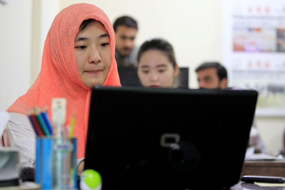 Reporters work at the office of Hushang, a Mandarin language weekly newspaper, in Islamabad, Pakistan, in this June 9,  2017 file photo. — Reuters