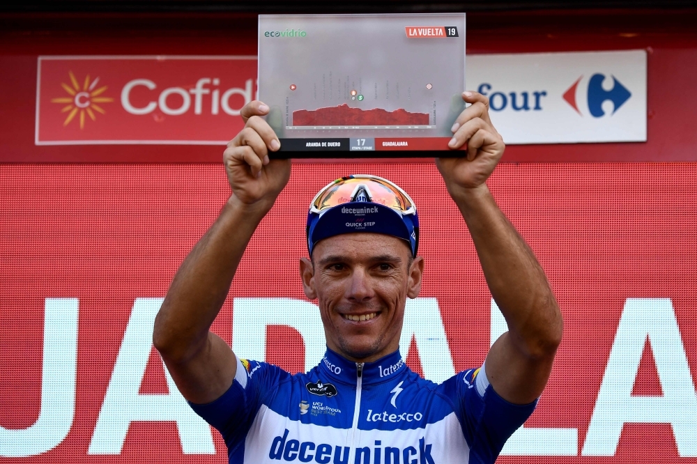 Team Deceuninck rider Belgium's Philippe Gilbert celebrates on the podium after winning the 17th stage of the 2019 La Vuelta cycling Tour of Spain, a 219,6 km race from Aranda de Duero to Guadalajara, on Wednesday. — AFP