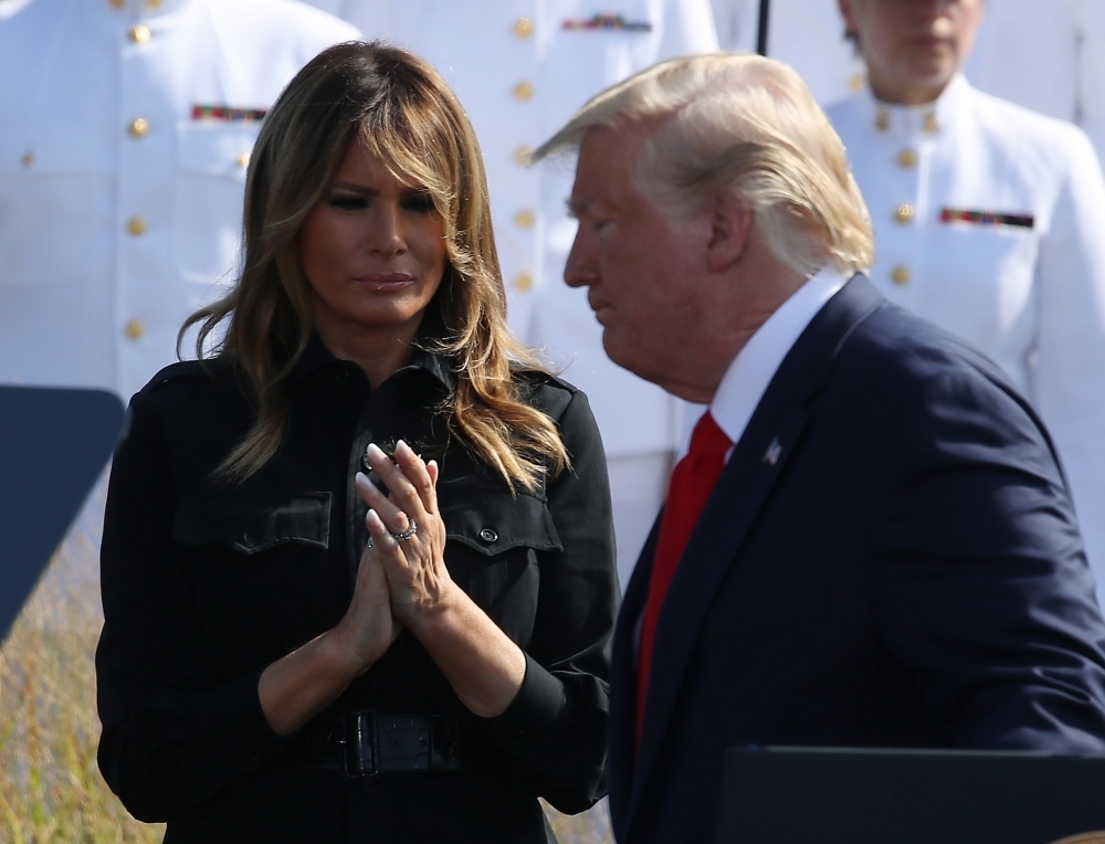 US President Donald Trump and first lady Melania Trump participate in a 911 memorial ceremony at the Pentagon to commemorate the anniversary of the 9/11 terror attacks in Arlington, Virginia, on Wednesday. — AFP