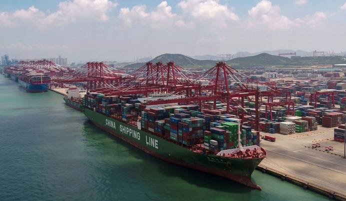 File photo of a container ship docked at a port in Qingdao, in eastern China’s Shandong Province. — AP 
