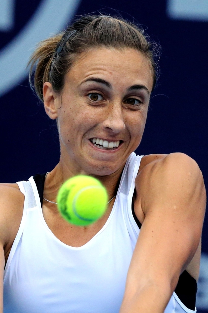 Petra Martic of Croatia hits a return during her women's singles semifinal match against Kristina Mladenovic of France at the Zhengzhou Open tennis tournament in Zhengzhou in China's central Henan province, on Saturday. — AFP