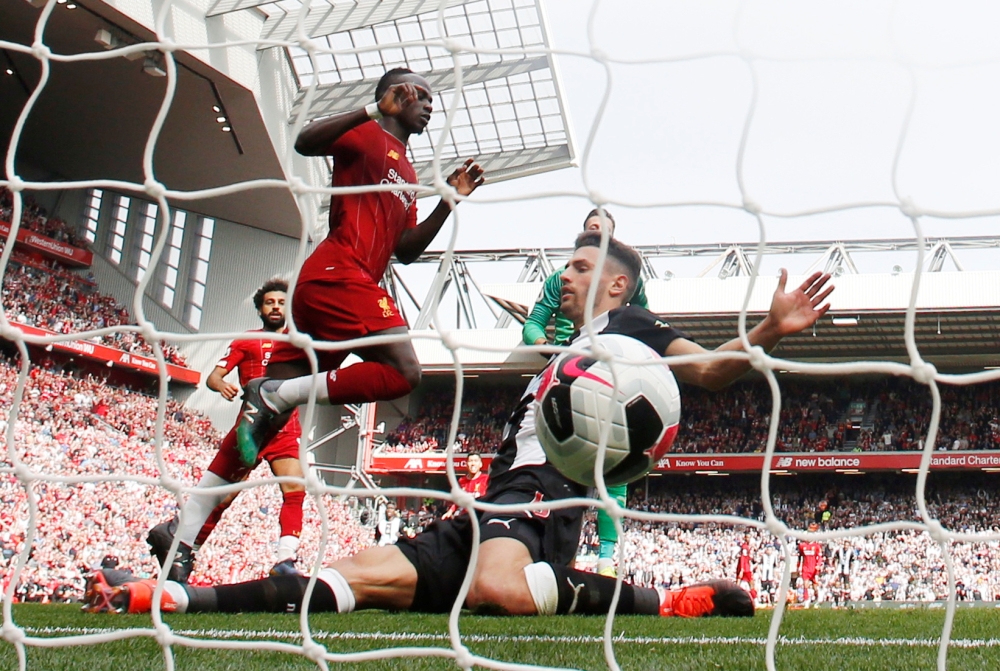 Liverpool's Sadio Mane scores their second goal against Newcastle United at Anfield, Liverpool, Britain, on Saturday. — Reuters
