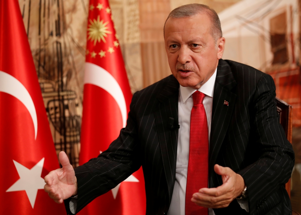 Turkish President Tayyip Erdogan speaks during an interview with Reuters in Istanbul, Turkey, on Friday. Turkey has ordered the arrest of 223 serving military personnel across the country and in the breakaway state of Northern Cyprus over suspected links to a network Ankara accuses of organizing an attempted coup in 2016, state media said on Saturday. — Reuters