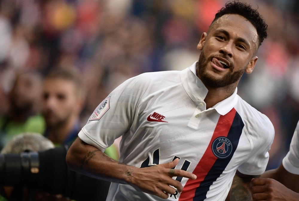 Paris Saint-Germain's Brazilian forward Neymar celebrates after scoring a goal during the French L1 football match between Paris Saint-Germain (PSG) and Racing Club de Strasbourg Alsace (RCS) at the Parc des Princes stadium in Paris, on Saturday. — AFP
