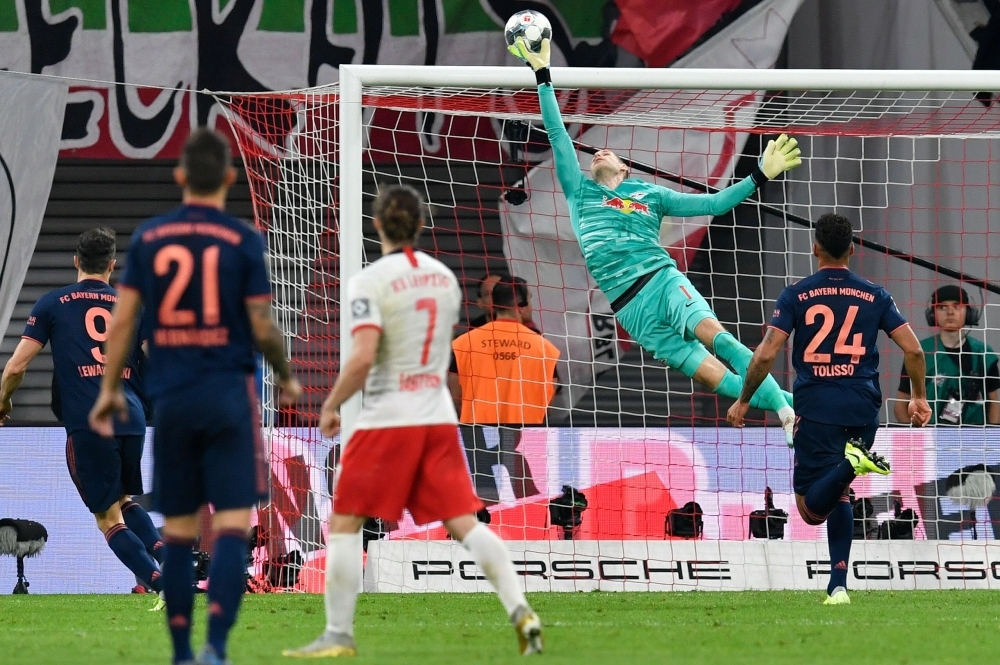 Leipzig's Hungarian goalkeeper Peter Gulacsi makes a save during the German first division Bundesliga football match against FC Bayern Munich in Leipzig, eastern Germany on Saturday. — AFP