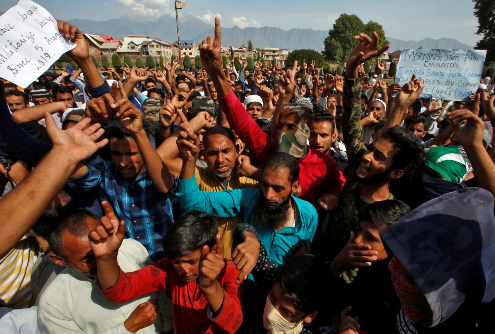 Kashmiris shout slogans at a protest site after Friday prayers during restrictions, following scrapping of the special constitutional status for Kashmir by the Indian government, in Srinagar on Friday. -Courtesy photo