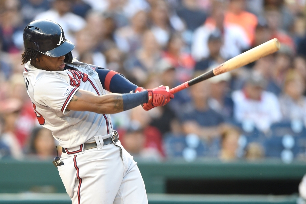 Ronald Acuna Jr. of the Atlanta Braves doubles during a baseball game against the Washington Nationals at Nationals Park in Washington, DC, on Saturday. — AFP
