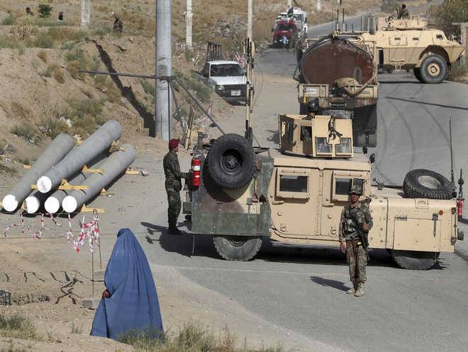 Afghan special forces stand guard at the site of a suicide car bomb explosion that killed at least four people, on the outskirts of Kabul, Afghanistan, on September 12, 2019. -Reuters