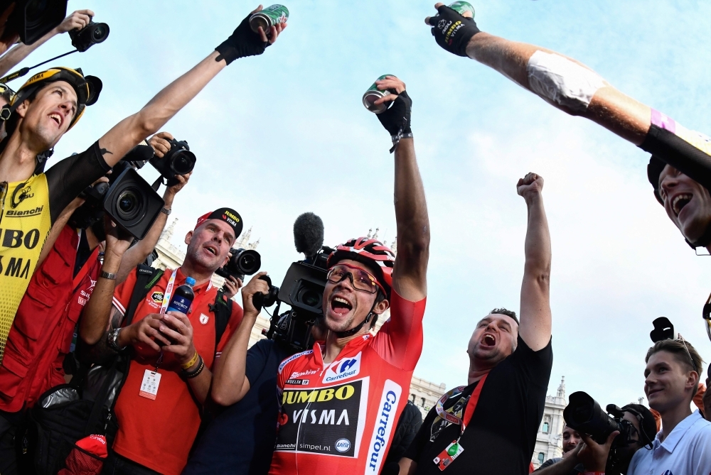 Team Jumbo rider Slovenia's Primoz Roglic (C) celebrates with his teammates after winning the 21st and last stage of the 2019 La Vuelta cycling Tour of Spain, a 106,6 km race from Fuenlabrada to Madrid, on Sunday. — AFP