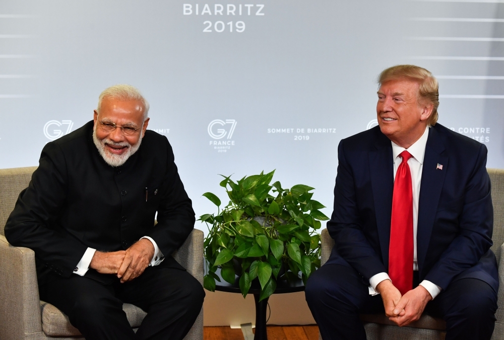 In this file photo taken on August 25, 2019 Indian Prime Minister Narendra Modi and US President Donald Trump speak during a bilateral meeting in Biarritz, southwest France on the third day of the annual G7 Summit. -AFP