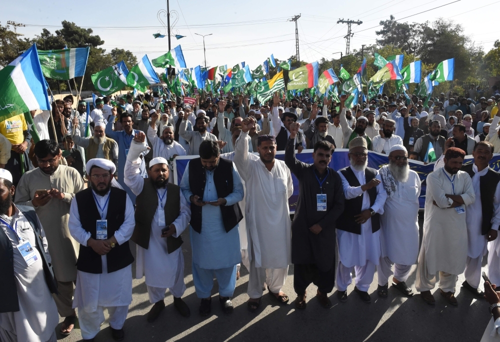 Activists of Jamaat-e-Islami Pakistan march as they shout anti-Indian slogans during a protest in the support of the citizens of Indian administered Kashmir in Quetta on Sunday. — AFP