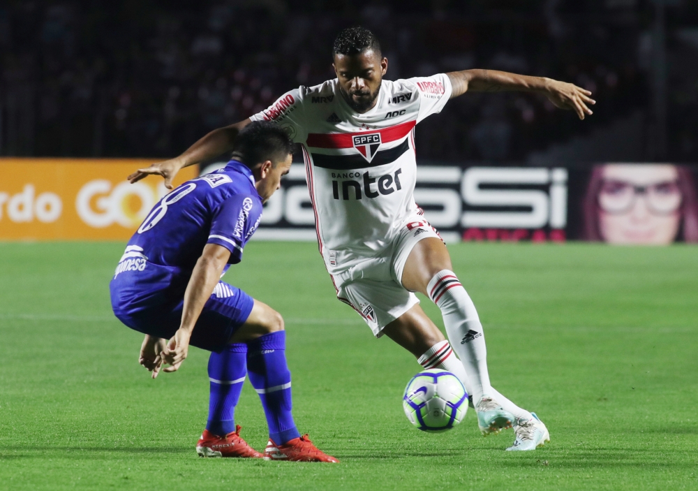 Sao Paulo's Reinaldo in action with CSA's Dawhan during Brasileiro Championship at Morumbi Stadium, Sao Paulo, Brazil, on Sunday. — Reuters