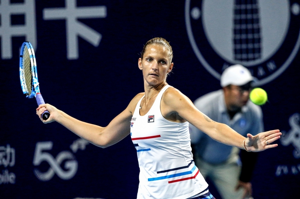 Karolina Pliskova of Czech Republic hits a return during her women's singles final match against Petra Martic of Croatia at the Zhengzhou Open tennis tournament in Zhengzhou in China's central Henan province, on Sunday. — AFP