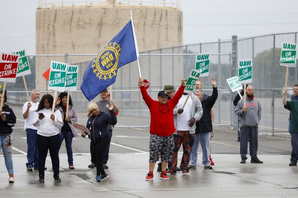 United Auto Workers (UAW) members picket at a gate at the General Motors Flint Assembly Plant after the UAW declared a national strike against GM on Monday in Flint, Michigan. -AFP