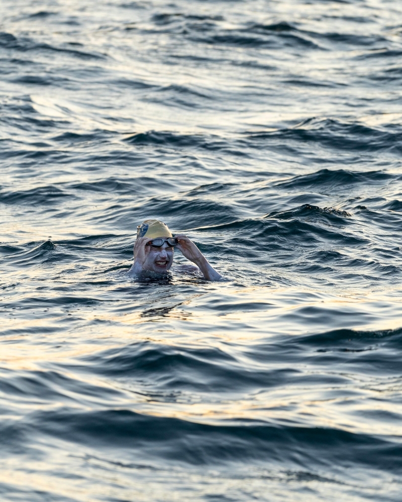 A handout photograph taken off the coast of Dover, southern England on Sunday, and released by Jon Washer Photoraphy on Tuesday shows US swimmer Sarah Thomas swimming in the Dover Strait, 10 miles off the English coast, on the first leg of her non-stop four leg, 54 hour, cross-Channel swim between England and France. — AFP
