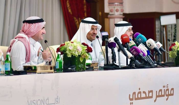 Energy Minister Prince Abdulaziz Bin Salman, center, with Aramco Chairman Yasir Al-Rumayyan, left, and CEO Amin Nasser speak during the press conference at Ritz Carlton in Jeddah on Tuesday.