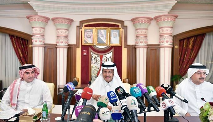 Energy Minister Prince Abdulaziz Bin Salman, center, with Aramco Chairman Yasir Al-Rumayyan, left, and CEO Amin Nasser speak during the press conference at Ritz Carlton in Jeddah on Tuesday.