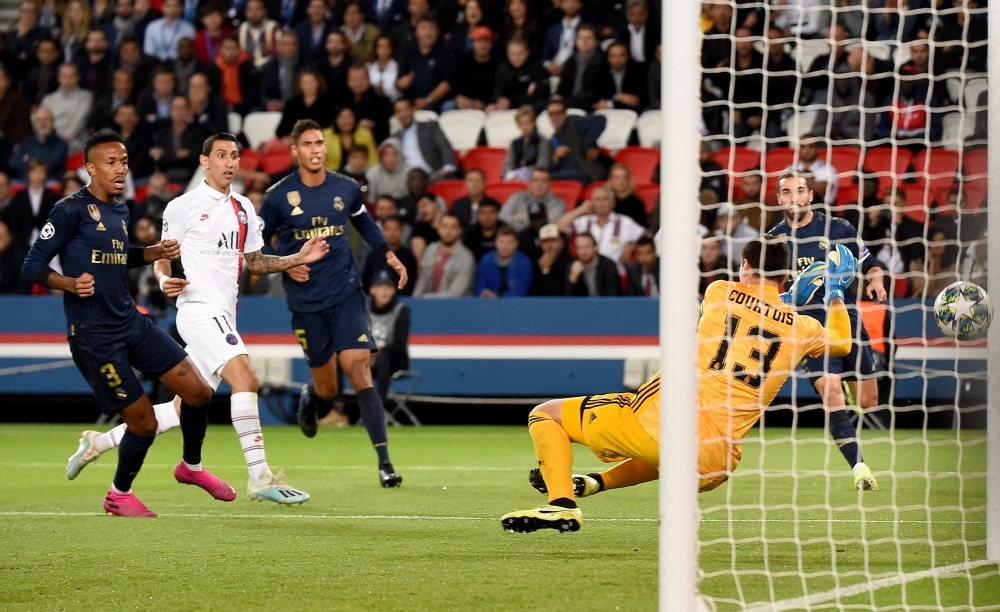 Paris Saint-Germain's Argentine midfielder Angel Di Maria scores his team's first goal during the UEFA Champions league Group A football match against Real Madrid, at the Parc des Princes stadium, in Paris, on Wednesday. — AFP