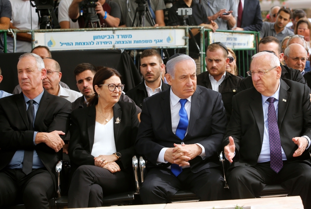 From R to L: Israeli President Reuven Rivlin, Prime Minister Benjamin Netanyahu, Israeli president of the Supreme Court Esther Hayut and Benny Gantz, leader of Blue and White party, attend a memorial ceremony for late Israeli president Shimon Peres, at Mount Herzl in Jerusalem on Thursday. Netanyahu called on his main challenger Benny Gantz to form a unity government together, a major development after deadlocked election results put his long tenure in office at risk. — AFP