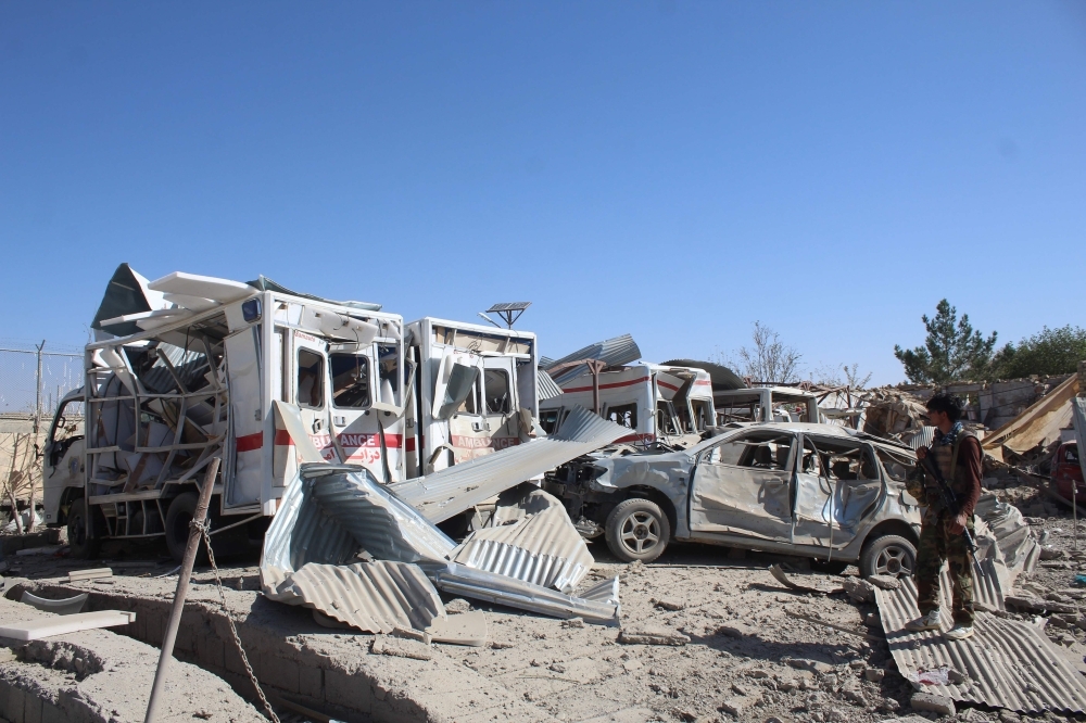 Afghan security forces investigate the site where a Taliban car bomb detonated near an intelligence services building in Qalat in Zabul province on Thursday. A car bomb attack targeting an intelligence services building in the southern Afghan city of Qalat left at least 10 people dead and 85 wounded, the governor of Zabul province said. — AFP