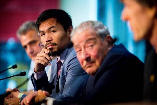 Philippine boxer Manny Pacquiao, second left,  and boxing promoter Bob Arum, second right, attend a press conference to promote Pacquiao's upcoming WBO Welterweight title fight against Australian challenger Jeff Horn at Suncorp Stadium in Brisbane on June 28, 2017. — AFP