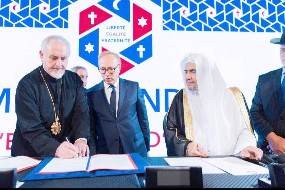 Muhammad Al-Issa, secretary general of MWL, with leaders of the Abrahamic Family while signing the Paris Agreement on Thursday. — SPA