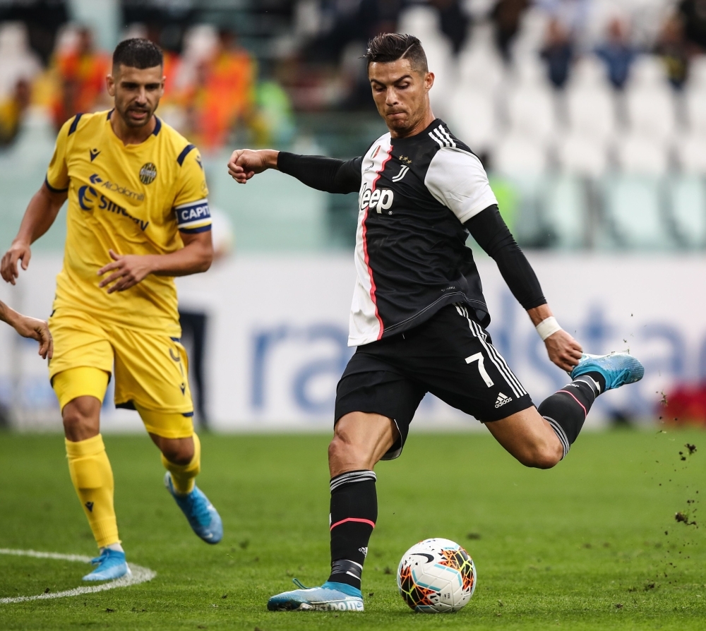 Juventus' Portuguese forward Cristiano Ronaldo shoots on goal during the Italian Serie A football match against Verona at the Juventus stadium in Turin, on Saturday. — AFP