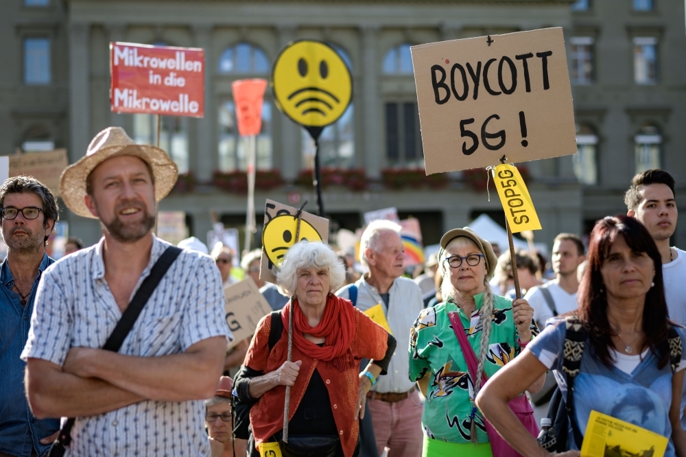 People take part to a nationwide protest against the 5G technology and 5G-compatible antennae deployment in front of the Swiss house of Parliament in Bern, on Saturday. -AFP



















 / AFP / Fabrice COFFRINI