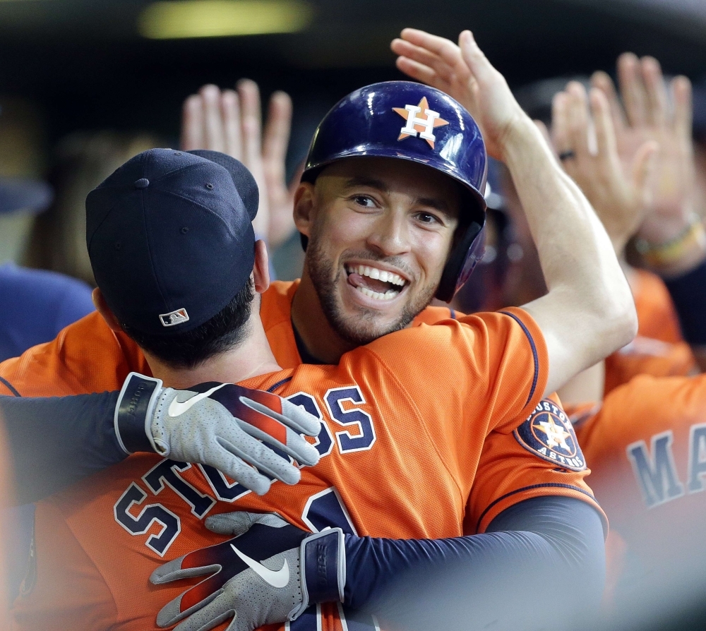 George Springer No. 4 of the Houston Astros hits his third home run of the game in the fourth inning against the Los Angeles Angels at Minute Maid Park on Sunday in Houston, Texas. — AFP