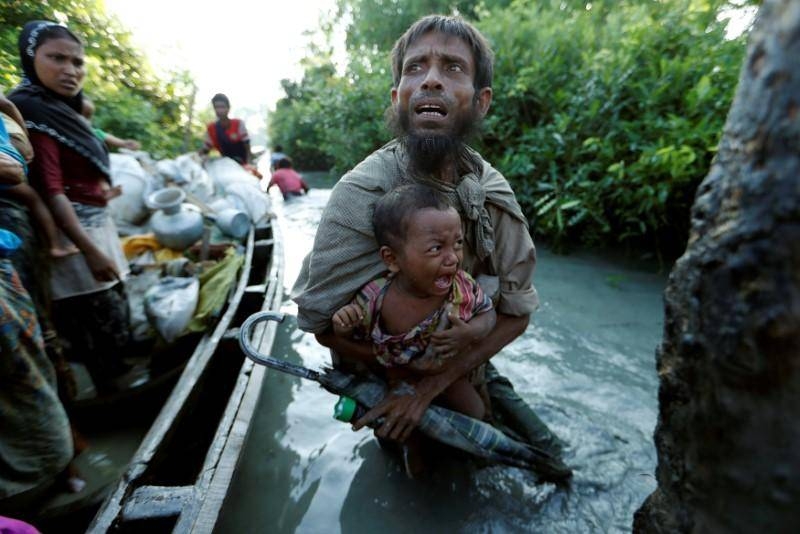 Rohingya refugees arrive to the Bangladeshi side of the Naf river after crossing the border from Myanmar, in Palang Khali, Bangladesh in this file photo. — Reuters