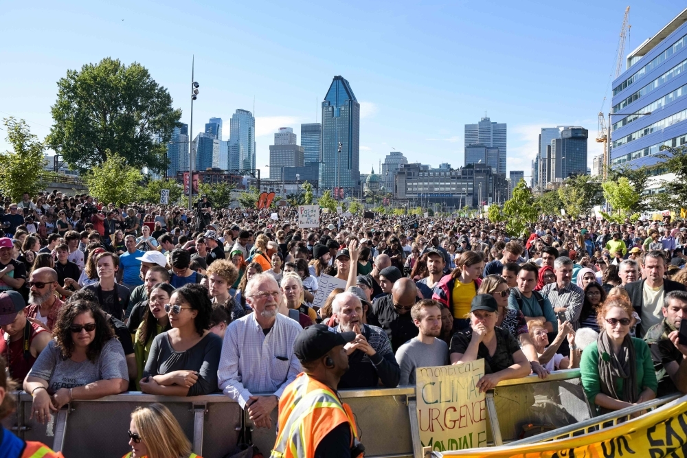 Activists rally for action on climate change on Friday in Montreal, Canada. -AFP