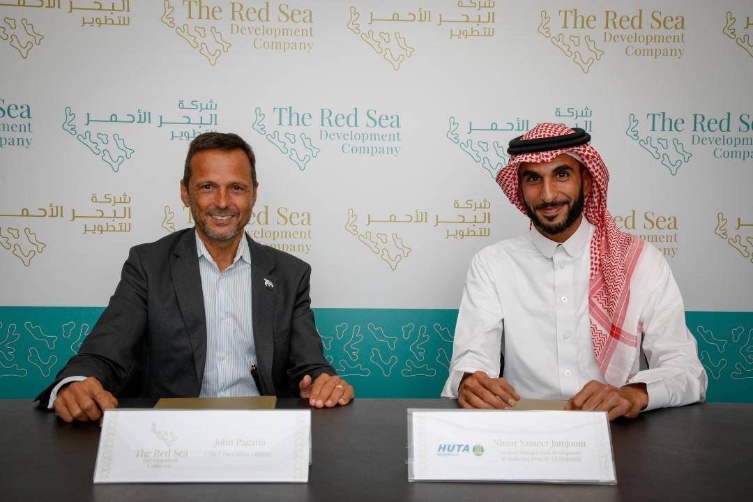 John Pagano, CEO of The Red Sea Development Company, and HUTA Hegerfield and Saudconsult representative after signing the contract. — Courtesy photo