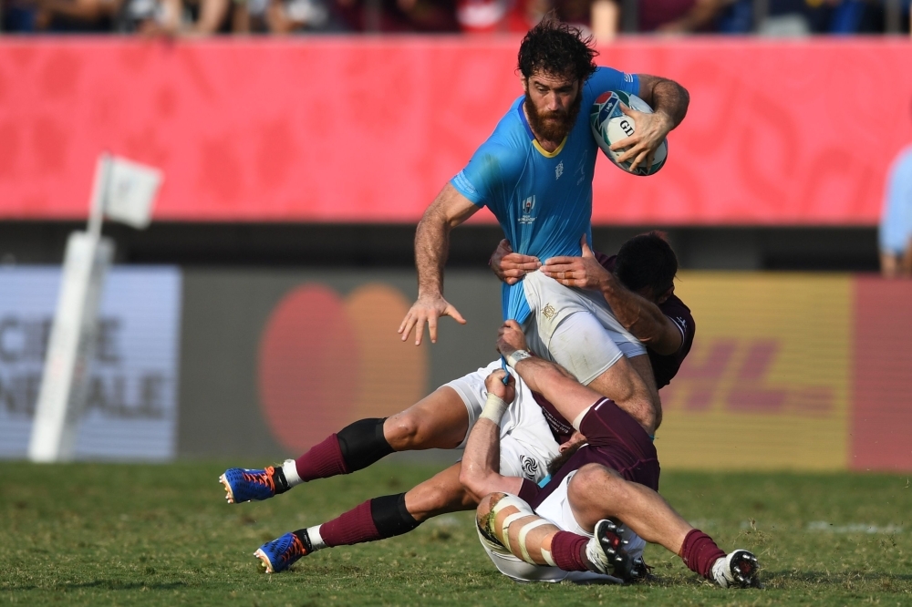 Wales' lock Alun Wyn Jones (C) is is tackled by Australia's lock Rory Arnold (C-L) during the Japan 2019 Rugby World Cup Pool D match between Australia and Wales at the Tokyo Stadium in Tokyo, on Sunday. — AFP