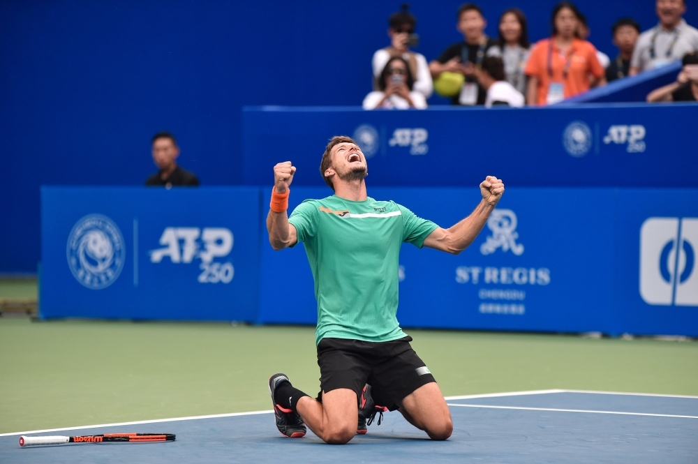 Pablo Carreno Busta of Spain celebrates his victory in the men's singles final match against Alexander Bublik of Kazakhstan at the Chengdu Open tennis tournament in Chengdu in China's southwestern Sichuan province, on Sunday. — AFP