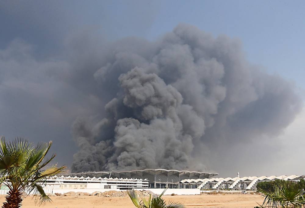 The Civil Defense forces, with the support of helicopters, battled for long hours to put out the fire that engulfed the roof of the Haramain High Speed Rail station in Sulaymaniyah district in Jeddah on Sunday. — Okaz/SG photo by Amr Sallam