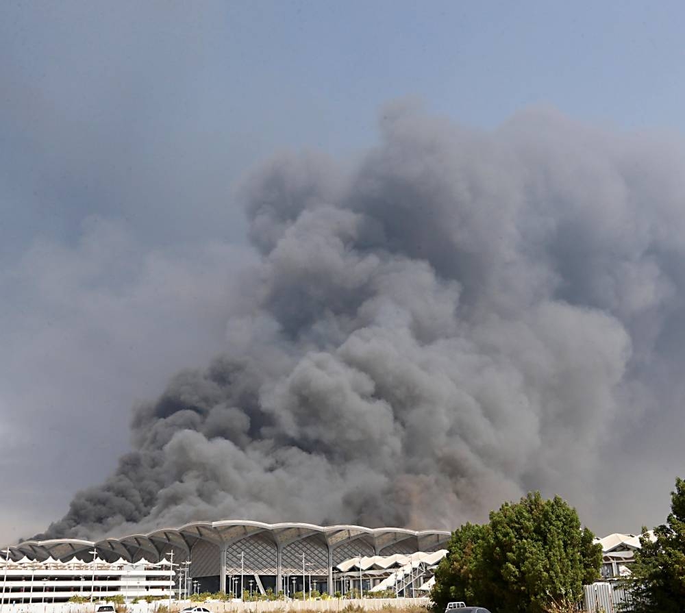 The Civil Defense forces, with the support of helicopters, battled for long hours to put out the fire that engulfed the roof of the Haramain High Speed Rail station in Sulaymaniyah district in Jeddah on Sunday. — Okaz/SG photo by Amr Sallam