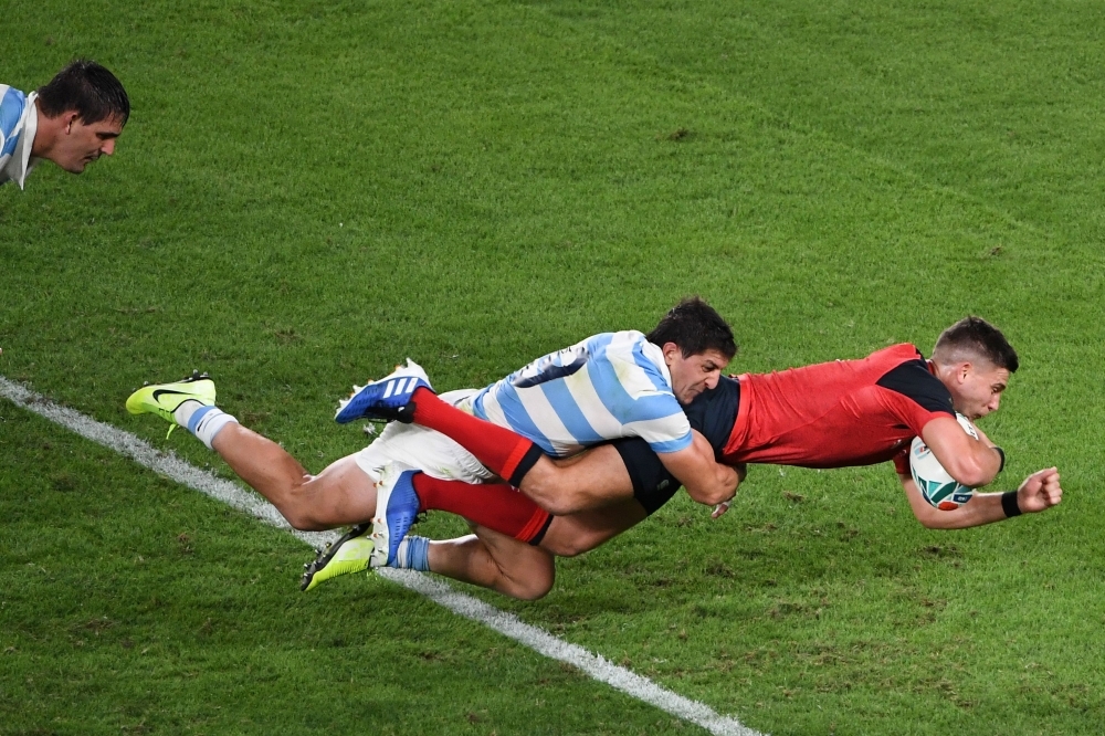 England's scrum-half Ben Youngs scores a try during the Japan 2019 Rugby World Cup Pool C match between England and Argentina at the Tokyo Stadium in Tokyo, on Saturday. — AFP