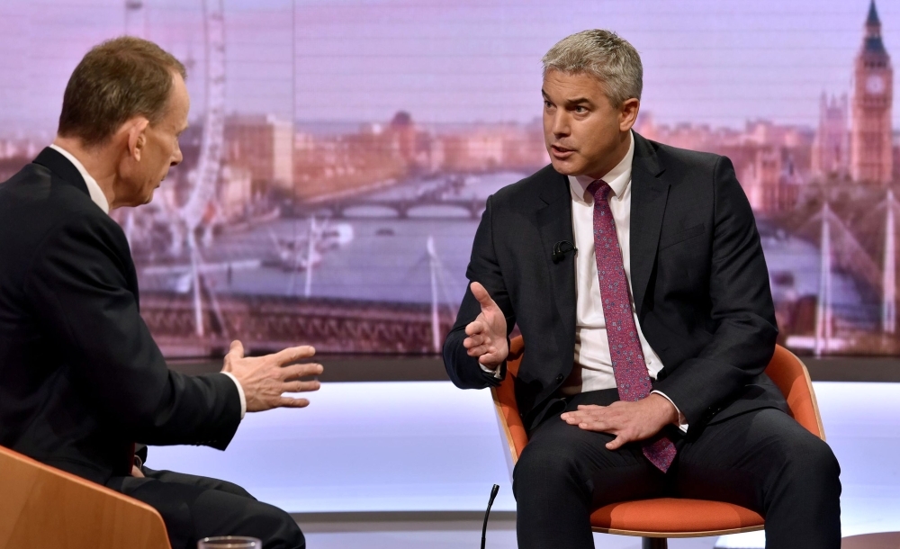 In this handout photograph taken and released by the BBC on Sunday, Britain's Secretary of State for Exiting the European Union (Brexit Minister) Stephen Barclay (R) gestures as he speaks to Andrew Marr (L) during an appearance on the BBC political program The Andrew Marr Show in Salford, near Manchester, north-west England. Brexit Secretary Stephen Barclay suggested Sunday that Britain is open to compromise with the EU over new UK proposals for Northern Ireland, but urged Brussels to show 