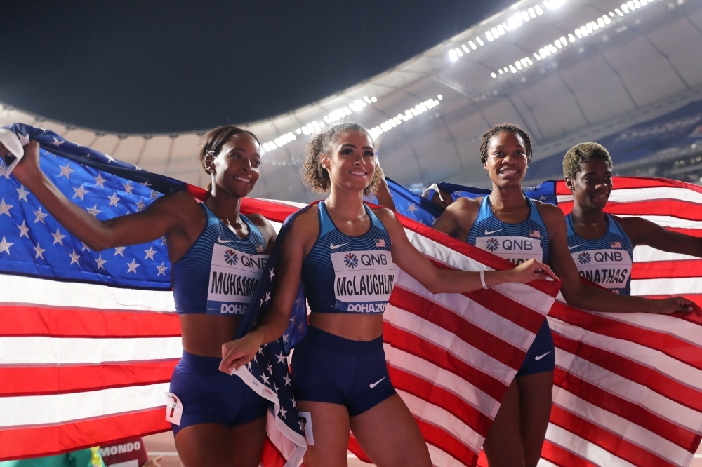 USA's Nia Ali holds the national flag after winning the women's 100m Hhurdles final at the 2019 IAAF Athletics World Championships at the Khalifa International stadium in Doha, on Sunday. — AFP