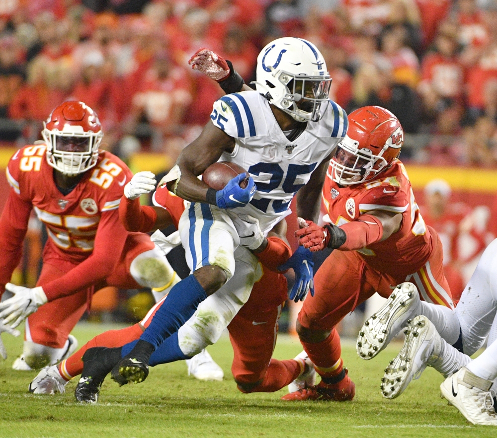 Indianapolis Colts running back Marlon Mack (25) runs the ball as Kansas City Chiefs outside linebacker Damien Wilson (54) attempts the tackle during the second half at Arrowhead Stadium in Kansas City, MO, USA, on Sunday. — Reuters