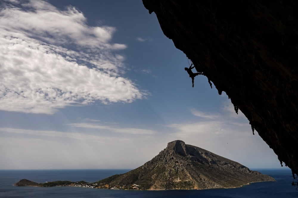 A climber participates in the 2019 annual Climbing Festival in the island of Kalymnos, Greece, in this October 4, 2019 file photo. The festival has attracted some 400 sports climbers from across the globe. The geography, the breathtaking views and the great weather conditions have made the Greek island of Kalymnos a top destination for international rock climbers of all levels with more than 2500 climbing routes. — AFP