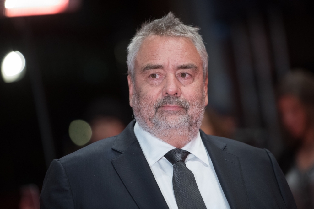 French director Luc Besson poses on the red carpet upon arrival for the premiere of the film 